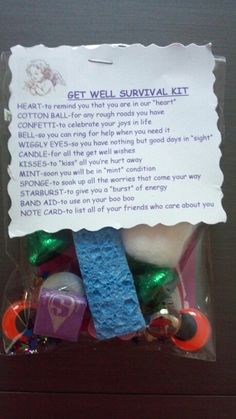 an assortment of candies and candy in a package with a note attached to it