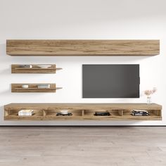 the entertainment center is made out of wood and has shelving units on each side