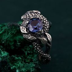 🌟 Warm Greetings, Jewelry Enthusiasts! 🌟 Step into a world where elegance meets personalization with our handcrafted silver rings. Each piece is a testament to unique artistry, blending mystical charm with modern finesse. Our collection offers a special touch for those who adore distinctive and thoughtfully designed jewelry. 🌈 Customization at Your Fingertips: Choose your perfect ring size and select from a variety of enchanting gemstones using our user-friendly dropdown menus. We delight in offering you the chance to create a ring that resonates with your personal style and story. ✨ Design It Your Way: Dreaming of a specific look? We're here to make it happen! Whether it's altering dimensions, adding extra gemstones, or choosing a different material, reach out to us. Your imagination i Sterling Silver Fantasy Rings As Gift, Sterling Silver Fantasy Ring, Fantasy Handmade Jewelry For Promise Ring, Handmade Fantasy Wedding Rings, Handmade Spiritual Snake Ring As Gift, Handmade Round Sapphire Promise Ring, Unique Round Snake Ring Gift, Unique Gemstone Snake Ring For Promise, Dragon Armor