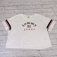 Tommy Hilfiger Tommy Jeans Crop T-Shirt. Large Logo On Front. Size Large. White. New. Never Worn. No Tags Please See Pictures For Details & Measurements As They Are Part Of The Description. Thanks For Looking! . Bundle Other Items & Save On Shipping! X50 Tommy Hilfiger White T-shirt With Graphic Print, Tommy Hilfiger Graphic Tee With Graphic Print, Tommy Hilfiger White Crew Neck Top, Tommy Hilfiger Graphic Print Tee, Sporty Tommy Hilfiger Tops With Graphic Print, Tommy Hilfiger Sporty T-shirt For Summer, Tommy Hilfiger Sporty Summer T-shirt, Tommy Hilfiger Graphic Tee With Letter Print, Tommy Hilfiger Tops With Logo Print For Spring