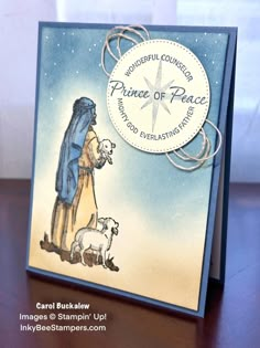 a handmade card with an image of a woman and her dog on it, which says prince of peace