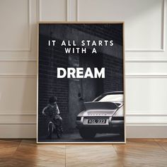 a poster with the words it all starts with a dream and a man on a bike