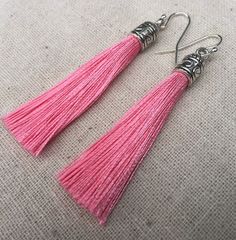 "Chic pink tassel earrings! They would add a pop of color to any outfit for any occasion. Dress them up or down. They are timeless and versatile. They are lightweight, fun and unique! The tassels measure 2 1/8\" long by 1/4\" wide. They hang from simple silver ear wire hooks. Overall drop length is about 2 1/4\". Metal is allergy free plated silver. These are my latest creation! I have them available in many colors! Find them all under the category tassel earrings in my shop. Thanks for stopping Pink Tassel Earrings With Latkans, Pink Tassel Jewelry As A Gift, Pink Dangle Tassel Earrings With Fringe, Pink Fringe Tassel Dangle Earrings, Pink Dangle Tassel Earrings For Gifts, Pink Tassel Earrings For Summer Gifts, Pink Tassel Earrings For Gift, Adjustable Pink Tassel Drop Earrings, Pink Tassel Drop Earrings