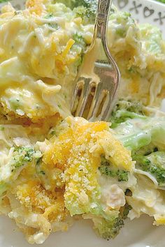 broccoli and cheese casserole on a plate with a fork