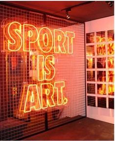 a neon sign that says sport is art