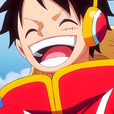 an anime character with headphones on his ears and mouth wide open, smiling at the camera