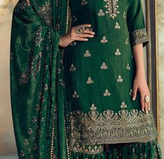 COLOR : Pine Green FABRIC : Top - Pure Dola Silk Jacquard, Bottom - Soft Crepe , Dupatta - Chinon Silk WORK : Woven Zari Work, Zari Embroidery, Digital Print, Hand Work, Beads, Stones, Sequins, Lace Border OCCASION : Wedding, Reception, Engagement, Party Wear READY-TO-WEAR : NoSTITCHING : Available as semi-stitched fabric, can be stitched using standard size option (+$20). Note: There might be a slight color variation due to lighting and flash used during photoshoot. The bright shade seen is the Wedding Gharara, Zari Embroidery, Holiday Promotions, Zari Work, Silk Wedding, Pine Green, Lace Border, Hand Work