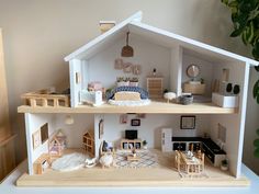 a doll house is shown with furniture and accessories