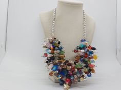 "Multicolored Necklace For Women - Chunky Necklace - One Of A Kind Necklace - Statement Necklace - Bib Necklace - Party Necklace - Great Gift This necklace measures 22 1/2\" in length.  This necklace is comprised of silver acrylic round beads, clear glass seed beads, purple glass pearls, cream glass pearls, red acrylic round beads, red glass hearts, red glass beads, green glass beads, green acrylic beads, pink glass beads, pink acrylic round beads, gold acrylic beads, blue glass round beads, blu Glass Hearts, Autumn Necklace, Statement Bib Necklace, Brown Necklace, Glass Stars, Purple Necklace, Party Necklace, Wooden Necklace, Pink Acrylic