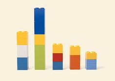 the building blocks are arranged in different colors and shapes to form a bar graph on a white background