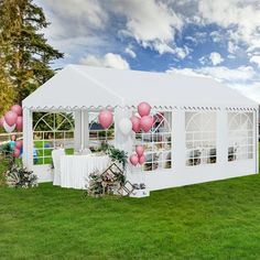 a white tent with pink and white balloons