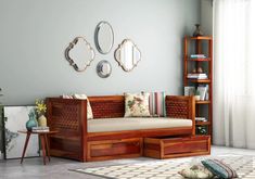 a living room scene with focus on the daybed and storage drawers in the corner