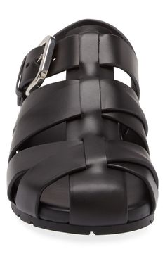 The Milanese label's intrecciato weave adds signature flair to a calfskin fisherman sandal finished with a softly squared, polished buckle. Adjustable strap with buckle closure Leather upper and lining/rubber sole Made in Italy Designer Shoes Fisherman Sandals, Fabric Gift Bags, Slingback Sandal, Mens Sandals, Black Sandals, Bottega Veneta, Calf Leather, Designer Shoes, Black Shoes