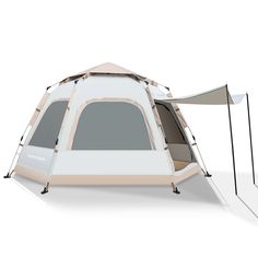 a tent that is set up on the ground with an awning attached to it