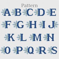 cross stitch alphabet with blue snowflakes on the upper and lower letters, all in different sizes