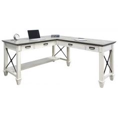 an l - shaped desk with two drawers and a laptop computer on the left side