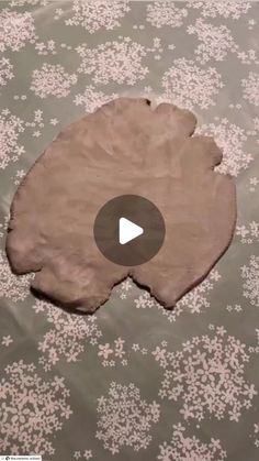 a piece of paper that has been made into a flower pattern with a video in the middle