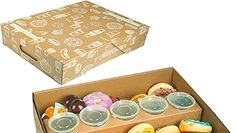 an open box with donuts and other pastries in it