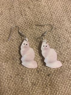 These pretty, acrylic, white cat earrings are perfect for that cat lover in your life! These are small/medium  sized earrings and are finished with ear wire to fit perfectly into your earlobes! Show your love for your pets with these earrings!  Like what you see? View more at: https://www.etsy.com/shop/StephsCraftingBits Cat Earrings, Kitty Cats, White Cat, Cat Mom, Ear Wire, Cat Lover, Jewelry Earrings Dangle, Cat Lovers, Dangle Drop Earrings