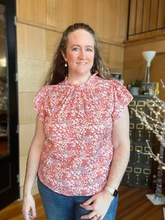 Flaunt a pretty, feminine look with our pink floral print plus size blouse. The ruffle sleeves add a fun touch to this flowy and lightweight top, perfect for pairing with slacks and a cardigan for work, or with shorts and sandals on vacation. Chic and versatile, it's a must-have in your wardrobe! Pink Flutter Sleeve Casual Top, Pink Butterfly Sleeve Top For Spring, Pink Ruffle Sleeve Top With Floral Print, Feminine Floral Print Top With Butterfly Sleeves, Pink Butterfly Sleeve Blouse For Spring, Feminine Floral Print Tops With Butterfly Sleeves, Feminine Blouse With Floral Print And Butterfly Sleeves, Cotton Tops With Floral Print And Butterfly Sleeves, Feminine Floral Print Top With Ruffle Sleeves