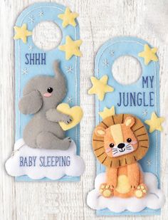 two tags with animals and stars on them, one has a baby sleeping tag in the shape of a lion