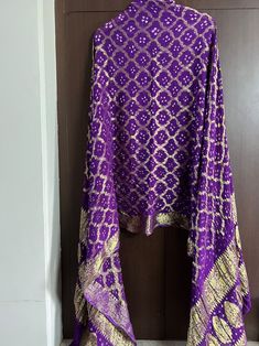 Mothers day special Jaipuri traditional bandhej dupatta ghatchola banarasi zari Dupatta party wear,wedding dupatta charkpiko free Beautiful Rajasthani bandhej with ghatchola dupatta Fabric - Banarasi silk zari dupatta Charkpiko free All colours available Handmade item Heavy Gharchola Bandhani Zari Work Bridal Dupatta , Women Silk Handmade Zari Work Dupatta, Traditional Wedding Dupatta Bandhani Dupatta Silk DM for choosing your color Materials This beautiful deep blue color-rich dupatta is perfec Purple Dori Work Dupatta For Festivals, Purple Gota Work Dupatta For Diwali, Purple Dupatta With Dori Work For Festivals, Purple Dupatta With Dori Work For Navratri, Purple Dupatta With Gota Work For Diwali, Purple Bollywood Dupatta With Dori Work, Bollywood Purple Dupatta With Dori Work, Purple Bandhani Print Dupatta, Festive Purple Dupatta With Bandhani Print