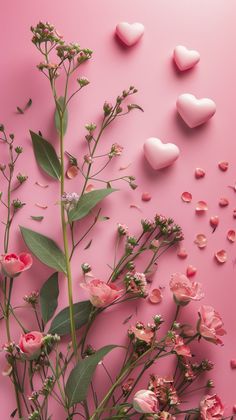 flowers and hearts on a pink background