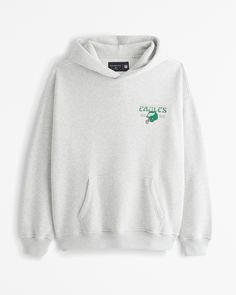 an embroidered sweatshirt with the words eagles on it in green and white, sitting against a white wall