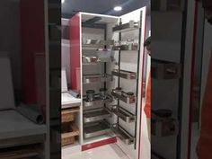 the inside of a refrigerator with its door open and shelves full of items in it