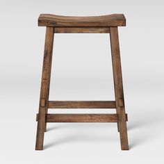 an old wooden stool on a white background