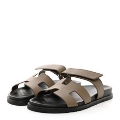 This is an authentic pair of HERMES Epsom Womens Chypre Sandals Size 41 in Etoupe. These stylish sandals are crafted of leather in eutope. They feature a toe strap across-over large Hermes H and an adjustable strap. Stylish Sandals, Adjustable Straps, Sandals, Leather