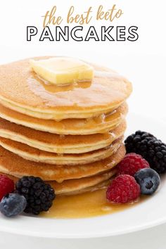 a stack of pancakes with syrup and berries on the plate next to it is text overlay that reads easy almond flour keto pancakes low carb - grain - free sugar - free