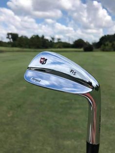 a close up of a golf club on the green