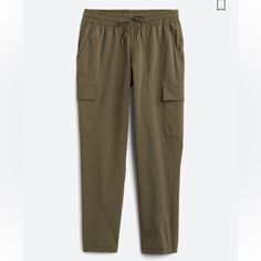 The North Face's Never Stop Wearing Cargo Pant Is A Versatile Choice For Everyday Wear. These Stretchy Pants Pair Well With T-Shirts And Tank Tops For Casual Athleisure Style, Or Dress Them Up With Blouses And Blazers. Print: Solid Cut: Straight Inseam: 28" Pockets: Front, Back Pants Closure: Drawstring Stretch: Has Stretch Materials: 87% Polyester, 13% Elastane Casual The North Face Pants With Elastic Waistband, The North Face Elastic Waistband Bottoms For Loungewear, The North Face Loungewear Bottoms With Elastic Waistband, White Sweatpants, Olive Shirt, Athleisure Style, The North Face Pants, Warm Pants, North Face Pants