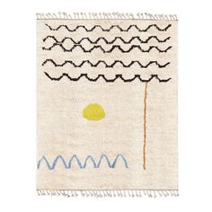 a white rug with blue and yellow waves on it