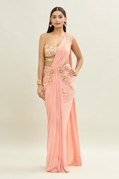 Peach pre-draped saree with thread and acrylic embroidery. Paired with an embroidered padded blouse with mesh detailing. - Aza Fashions Pre-draped Saree Dress With Zari Work, Pre-draped Fitted Saree With Dupatta, Embellished Pre-draped Saree For Wedding, Festive Wedding Pre-draped Saree, Pre-draped Festive Saree For Reception, Pre-draped Saree For Reception And Festive Occasions, Embellished Fitted Pre-draped Saree, Reception Saree With Cutdana Embroidery, Reception Draped Saree With Cutdana