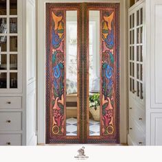 an ornate wooden door with glass panels