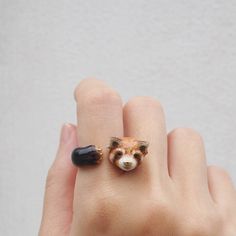 Hugging Red Panda Ring These hugging red panda are designed to be an adorable animal ring.Let your favourite animal hug you. The hugging red panda ring is completely unique handmade and hand painted individual, waiting for a special person to take care of it. MaryLou's products are mainly made of brass.  The base metal of our jewelry is plated with a layer of Gold (.25 Micron thickness) Then, put on one full coat of Enamel, which produces a hard durable acrylic finish.  TIPS *Do not expose it to any type of cream, lotion and perfume *Remove your jewelry during bathing, hand washing *To prevent an accelerated oxidation on jewelry, store them in airtight, such as ziplock bags. *The strong impact on solid objects can cause enamel coating jewelry to be cracked, chipped and scratched. Cute Red Ring As Gift, Cute Red Ring For Gift, Panda Ring, Animal Hugs, Panda Animal, Peacock Ring, Animal Ring, Animal Rings, Bird Jewelry