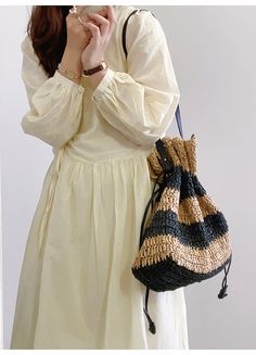 In Stock Fast Shipping From Los Angeles Saddle up for summer with the Elena Handbags Fashion Stripe Straw Drawstring Bag! This stylishly striped straw bag is the perfect accessory for the sizzle season. With its drawstring closure and light-as-air feel, it's the ideal accessory to cinch up your style. Saddle up and look sharp! Size: 38cm wide x 31cm tall (15in x 12in) Designer Style ID: 8482 Large Fashion Straw Woven Tote Bag, Vintage Vibes, Summer Bag, Everyday Shoulder Bag, Beach Bag Black Bucket Bag For Beach And Spring, Black Bucket Bag For Beach And Spring Season, Black Bucket Bag For Beach In Spring, Spring Beach Black Shoulder Bag, Casual Striped Woven Bag, Black Bucket Bag For Spring Vacation, Casual Striped Bags With Adjustable Strap, Casual Striped Straw Bag For Vacation, Casual Striped Woven Straw Bag