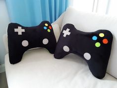 two pillows made to look like video game controllers