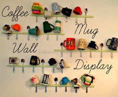 there is a coffee mug wall display with cups and other items on it, along with the words coffee mug wall display