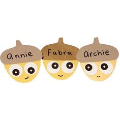 three little acorns with faces and words on them