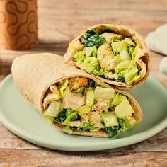 two wraps filled with chicken, broccoli and avocado on a plate