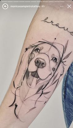 a dog's face on the arm is shown in black and grey ink, with an inscription above it