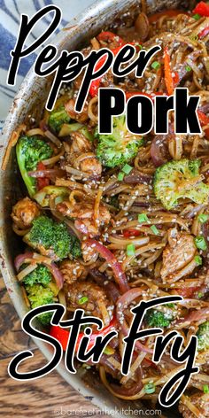 stir fry with broccoli, peppers and pork in a skillet on a wooden table