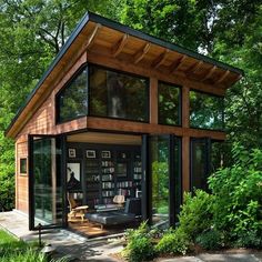 a small house in the middle of some trees