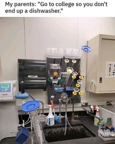 a kitchen sink filled with lots of clutter next to a water dispenser