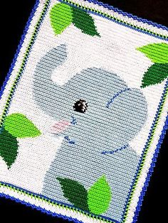 an elephant with green leaves on it's head is shown in this cross stitch pattern