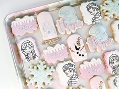 some frozen princess cookies are on a tray