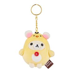 a small yellow stuffed animal keychain with a tag on it's side